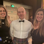 Lisa Wren and Donna O'Toole from August pose for a photo with Domenico D'Ambruoso from Sodexo Growth Academy (middle) at the 2025 Learning Awards Ceremony at the Grosvenor House Hotel, London.